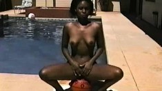 Jackie poses outside by the pool giving you a look at her fuck stuff