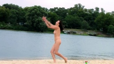 Nude beach girl is having a great time